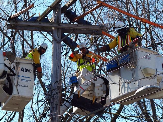 linemen restoring electricity