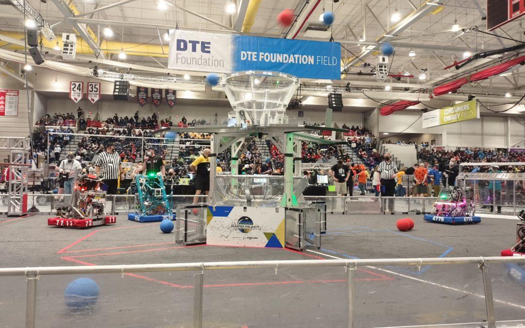 An indoor arena with robots competing