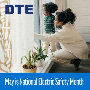 Mother at window with child showing him something outside.