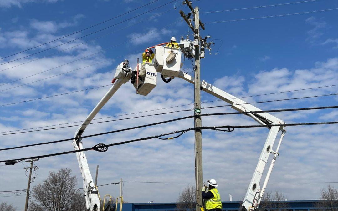 Overhead crews replace outdated equipment on utility pole