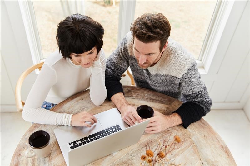 Couple looking at their DTE bill